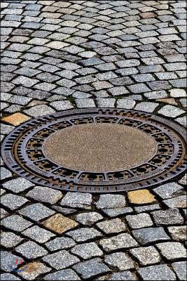 Manhole Cover on a Cobblestone Street Journal: Take Notes, Write Down Memories in this 150 Page Lined Journal